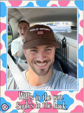 Will smiling in a car wearing a cap, with Soph behind him.